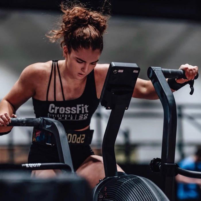 An athlete concentrating during an air bike effort