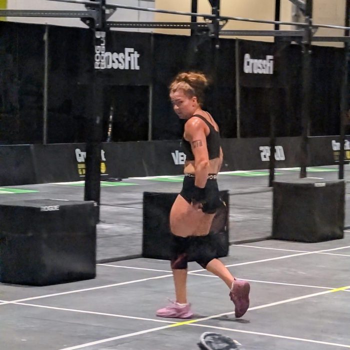 An athlete running between stations in a gym